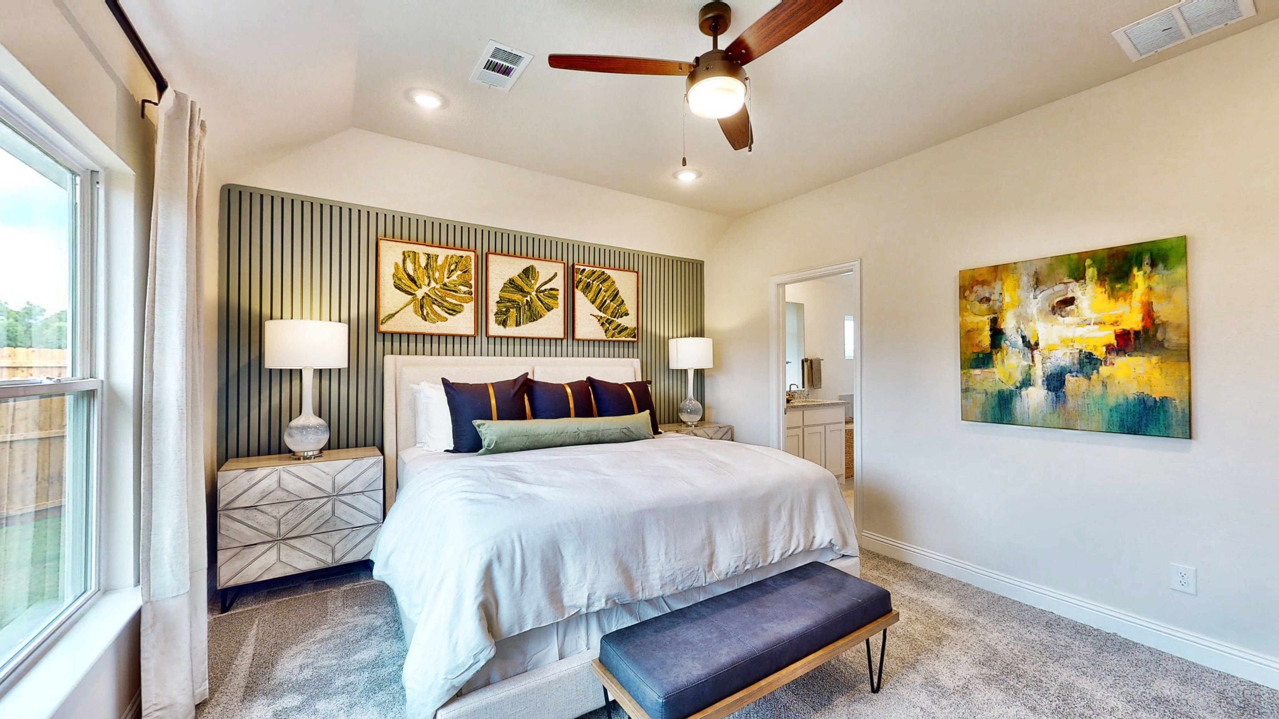 A bedroom with a large bed.