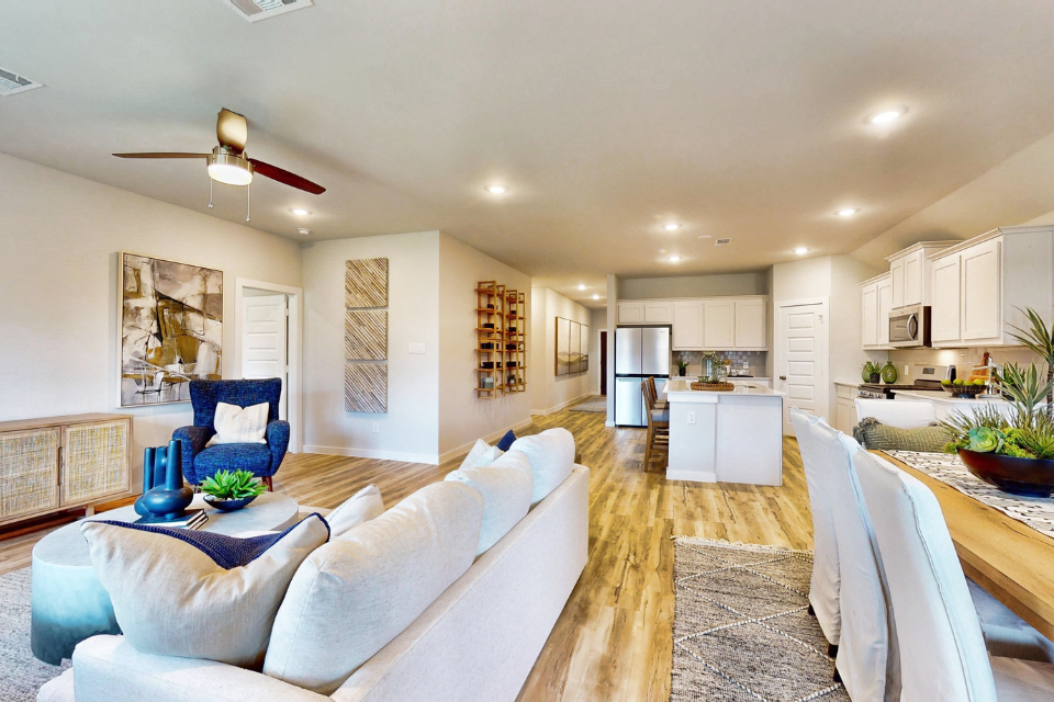 A living room with a couch and a table.