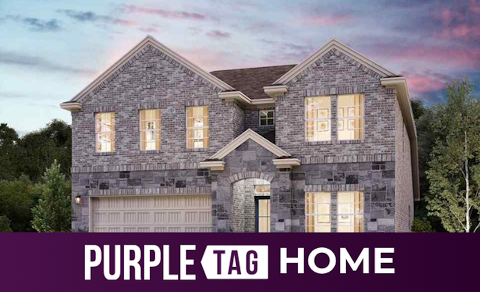 A large house with trees in the back.