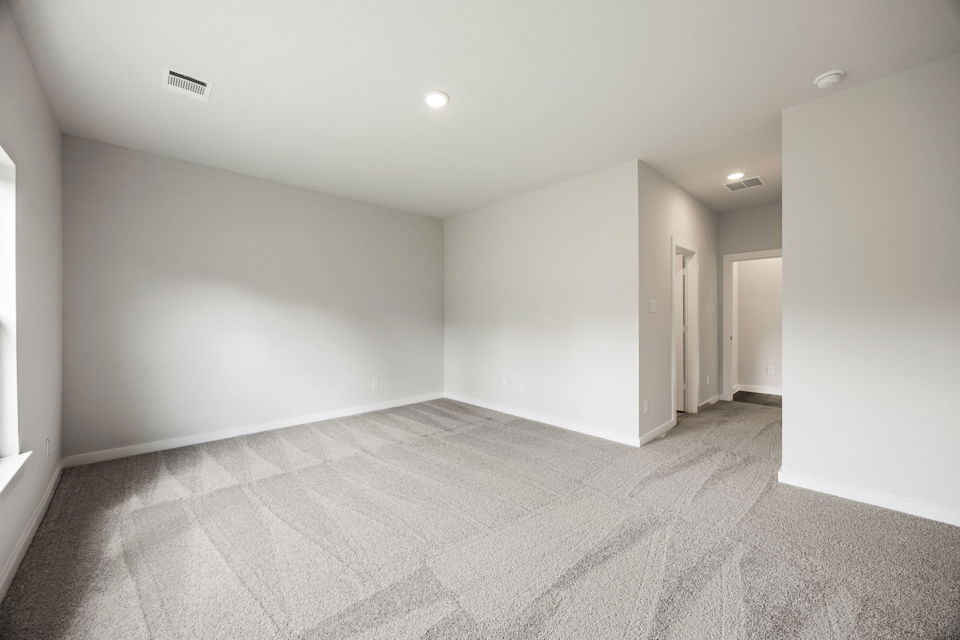 A hallway with white walls.