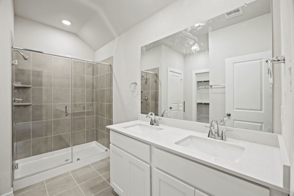 A bathroom with a glass shower.