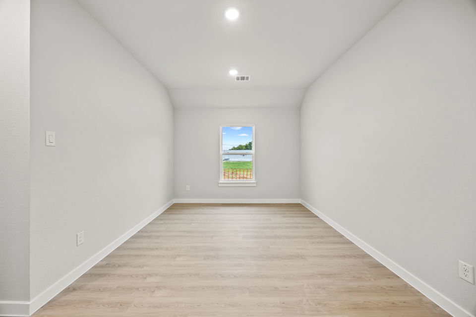 A hallway with white walls.