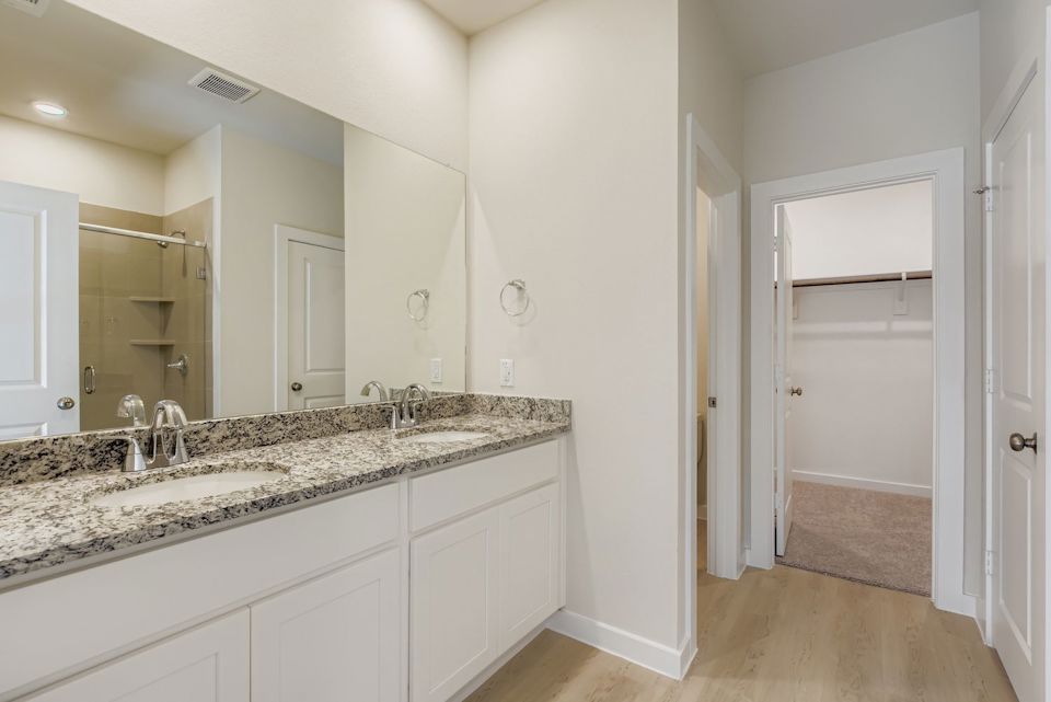A bathroom with a marble countertop.