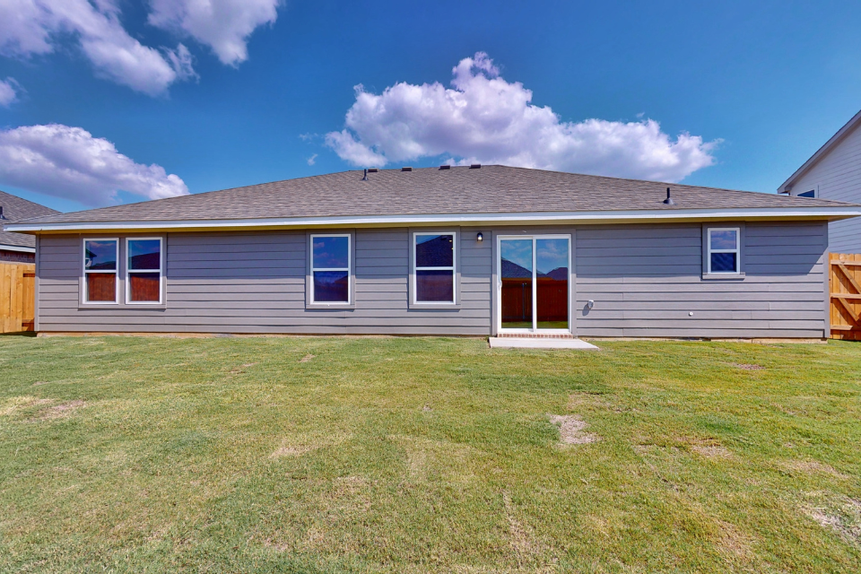 A house with a grass yard.