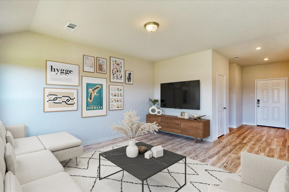 A living room with a tv and couches.