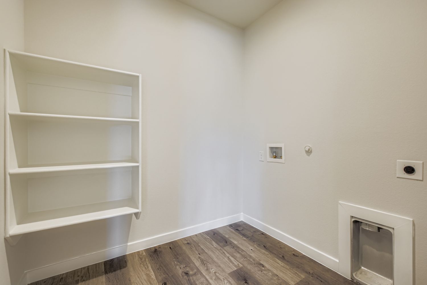 A white shelf in a room.