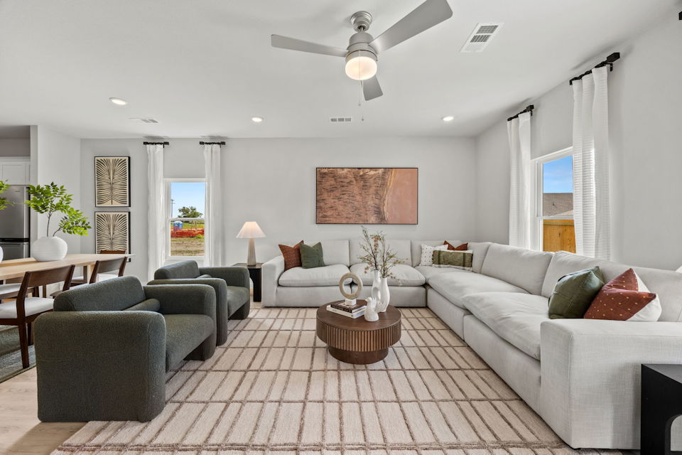 A living room with a couch and a table.