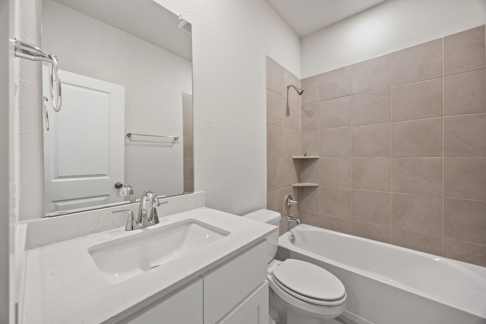 A bathroom with a sink and a toilet.