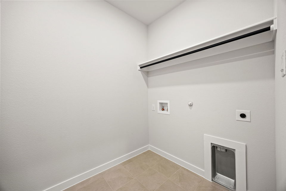 A white wall with a vent.