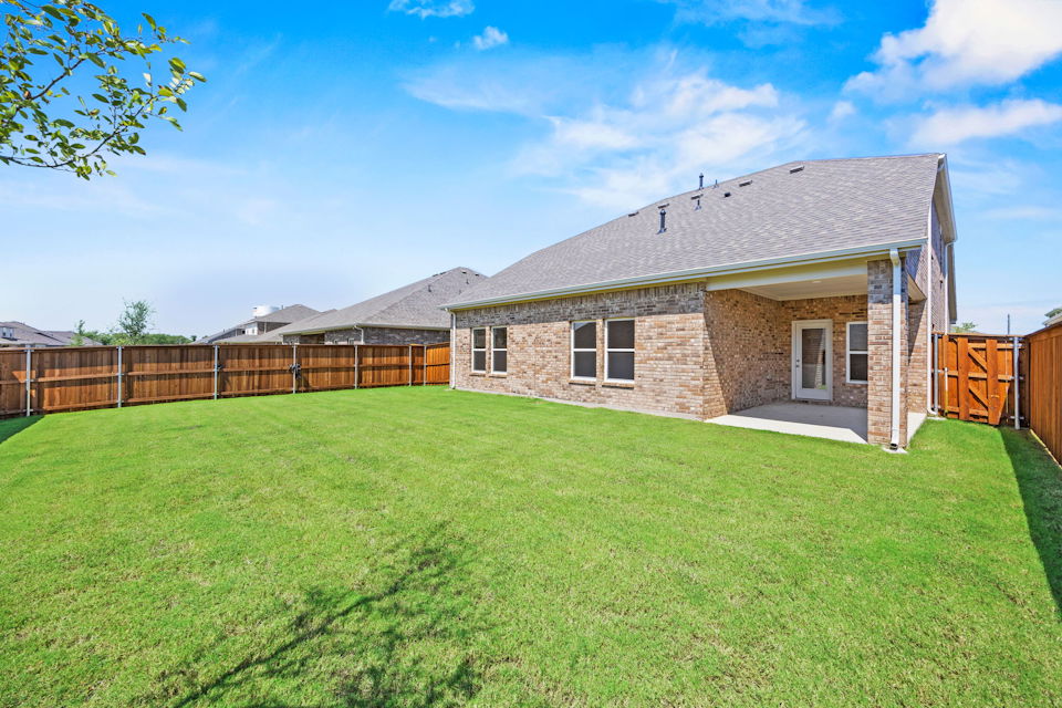 A house in a grassy yard.
