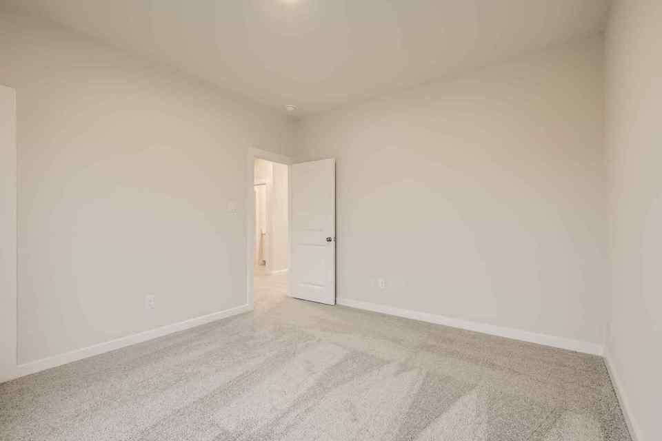 A hallway with white walls.