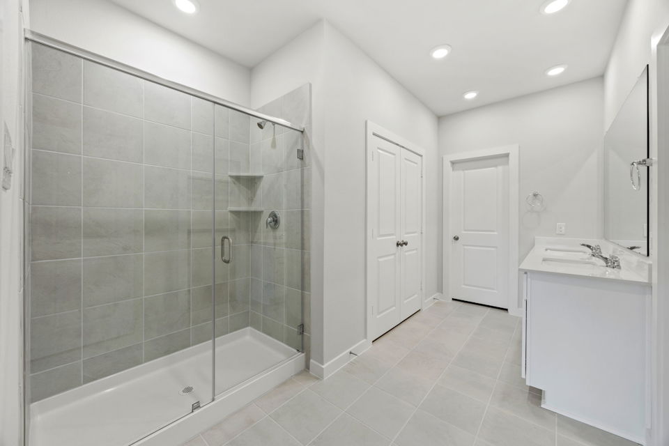 A bathroom with a glass shower.