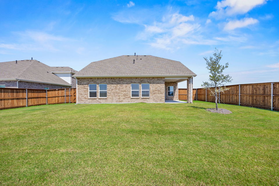 A house with a grass yard.
