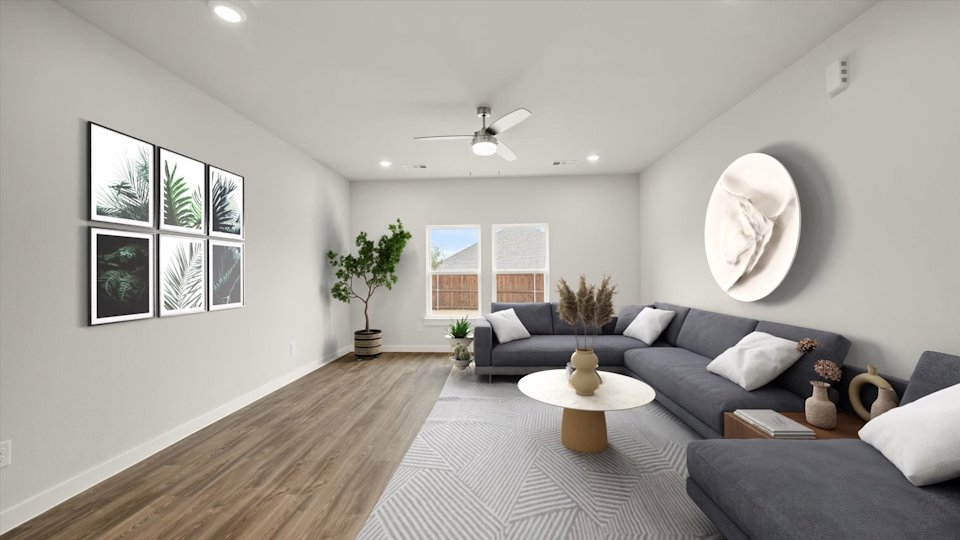 A living room with a couch and a table.