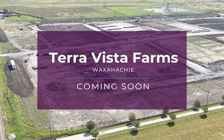 A large field with a sign.