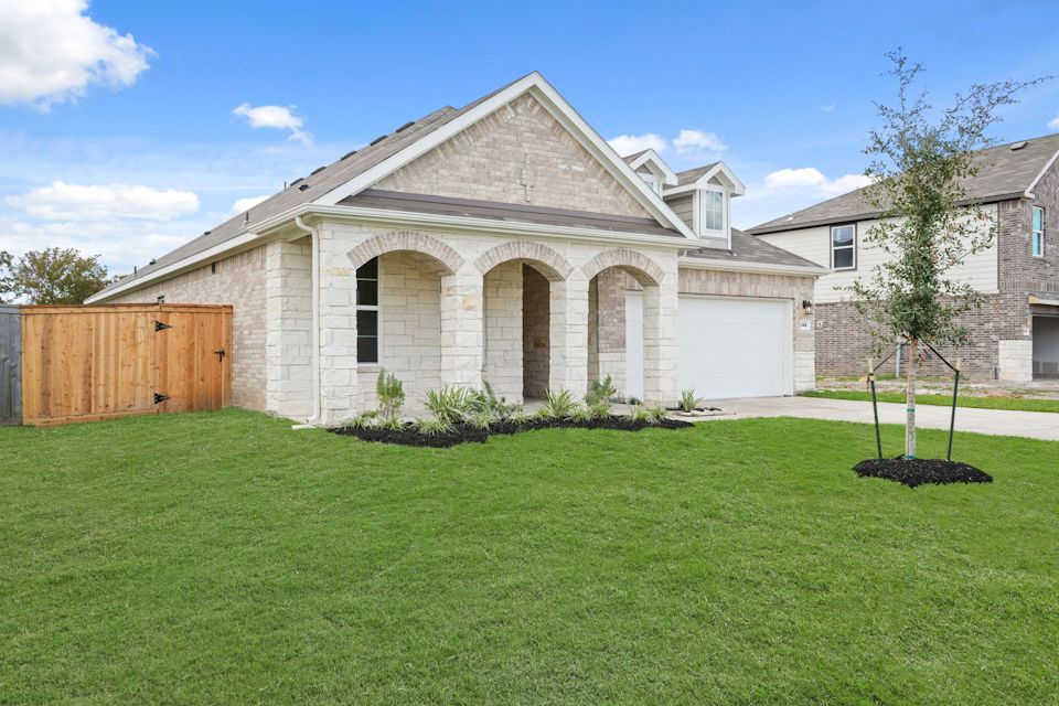 A house with a large front yard.