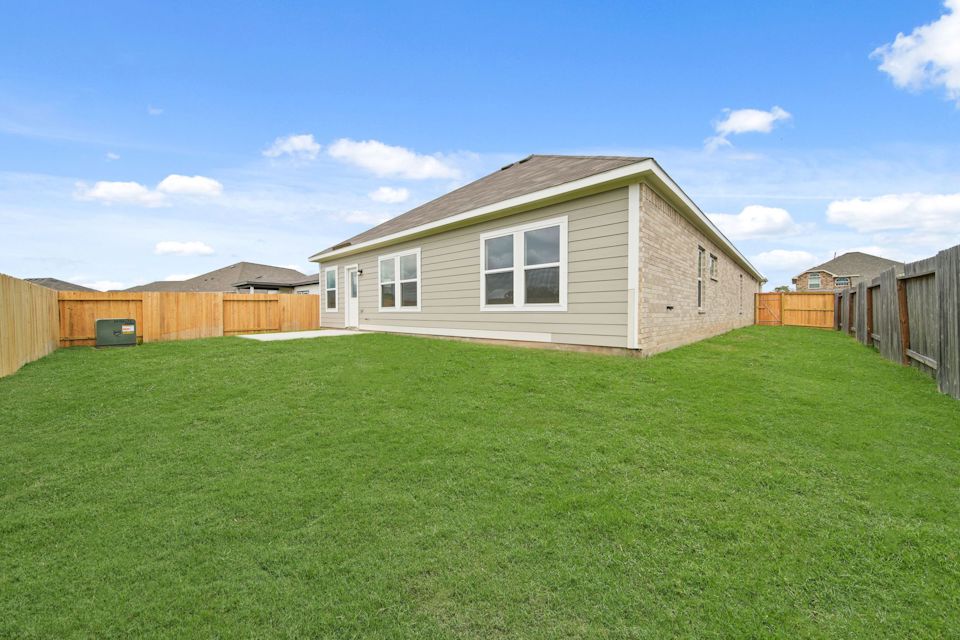 A house with a fence around it.