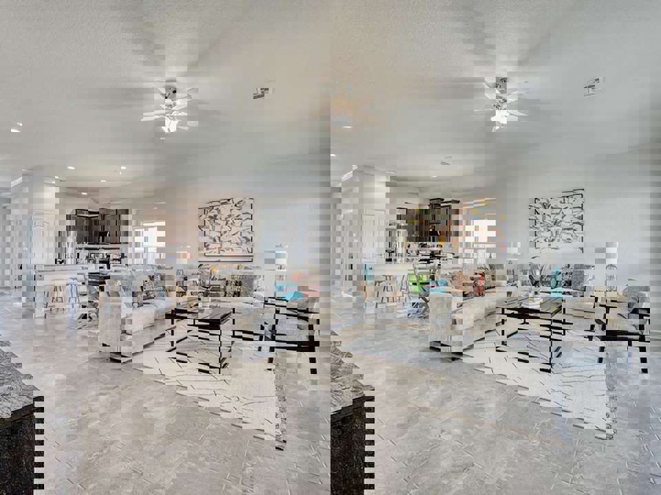 A living room with a tile floor.