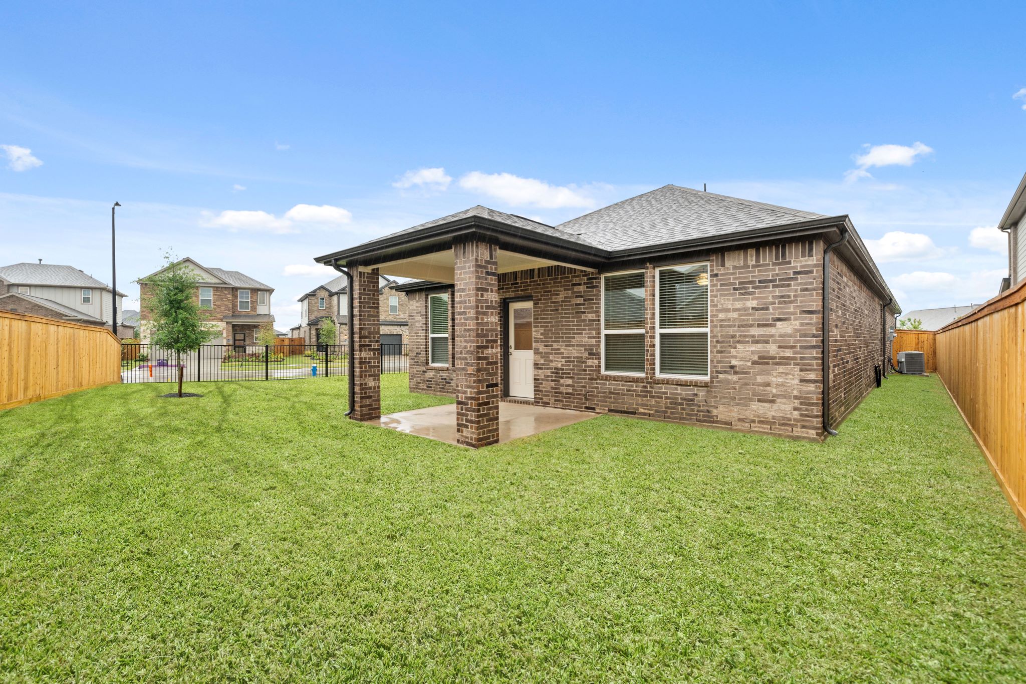 A house with a grass yard.