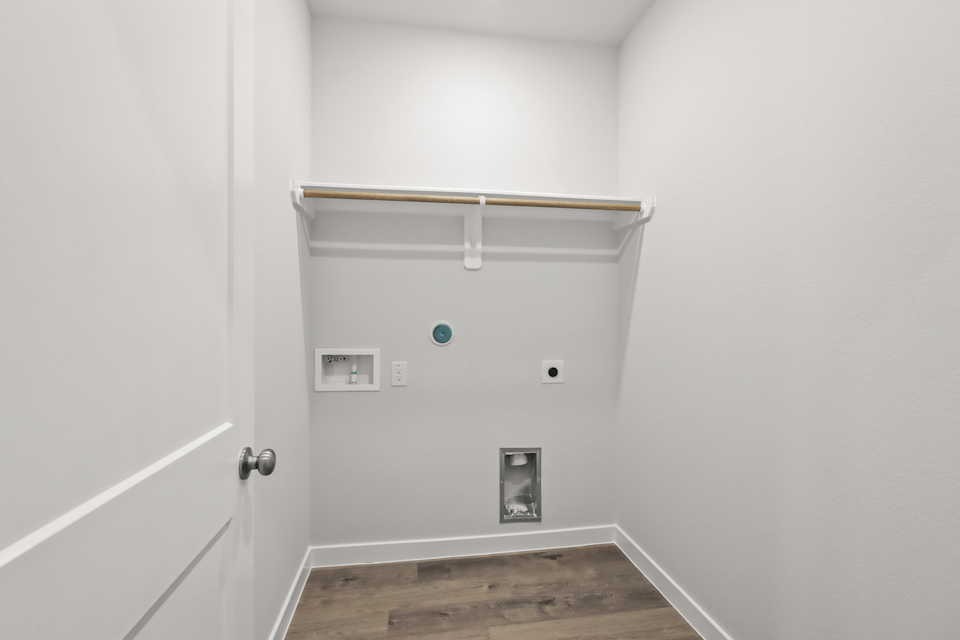 A white room with a door and a white door.