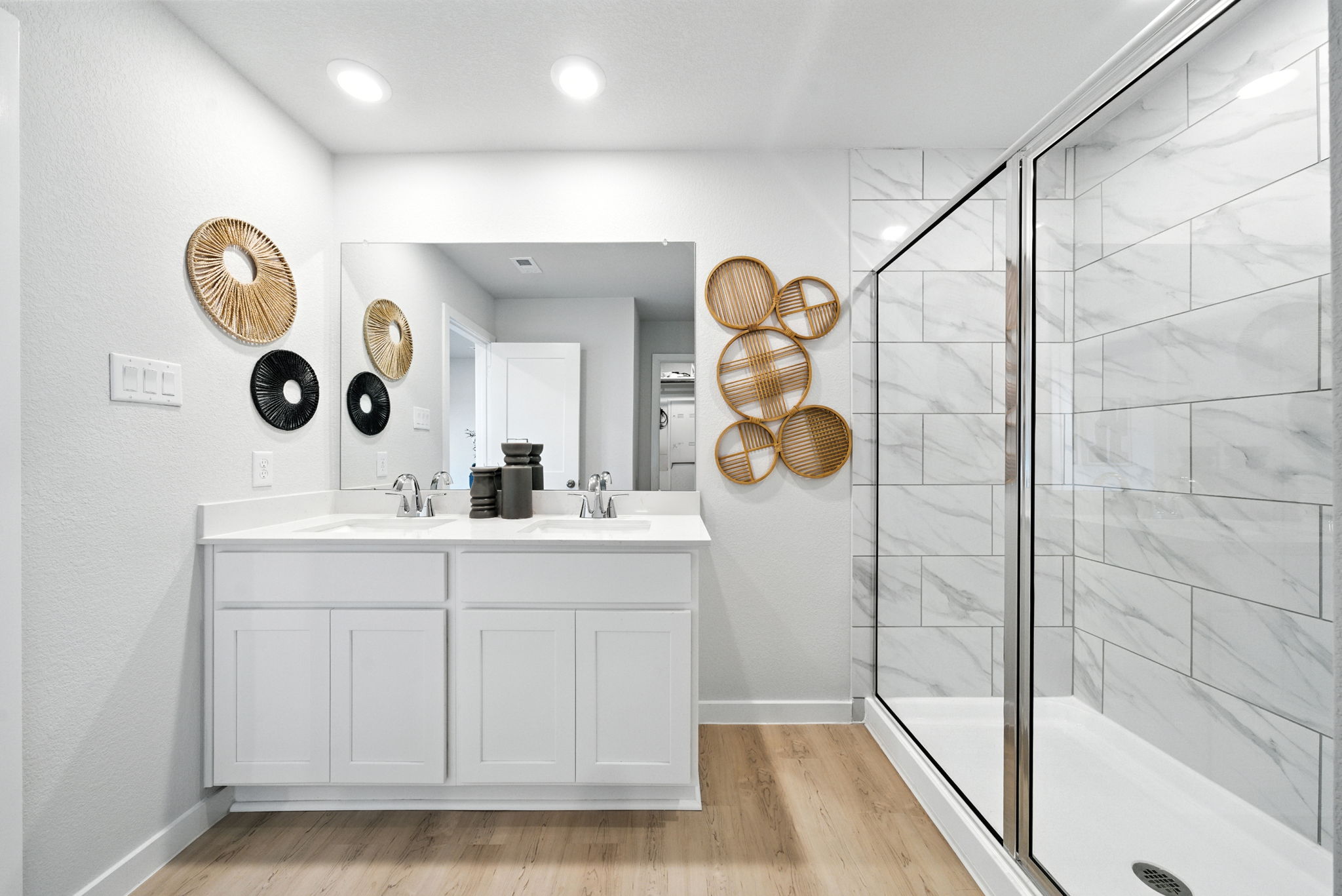 A bathroom with a glass shower.