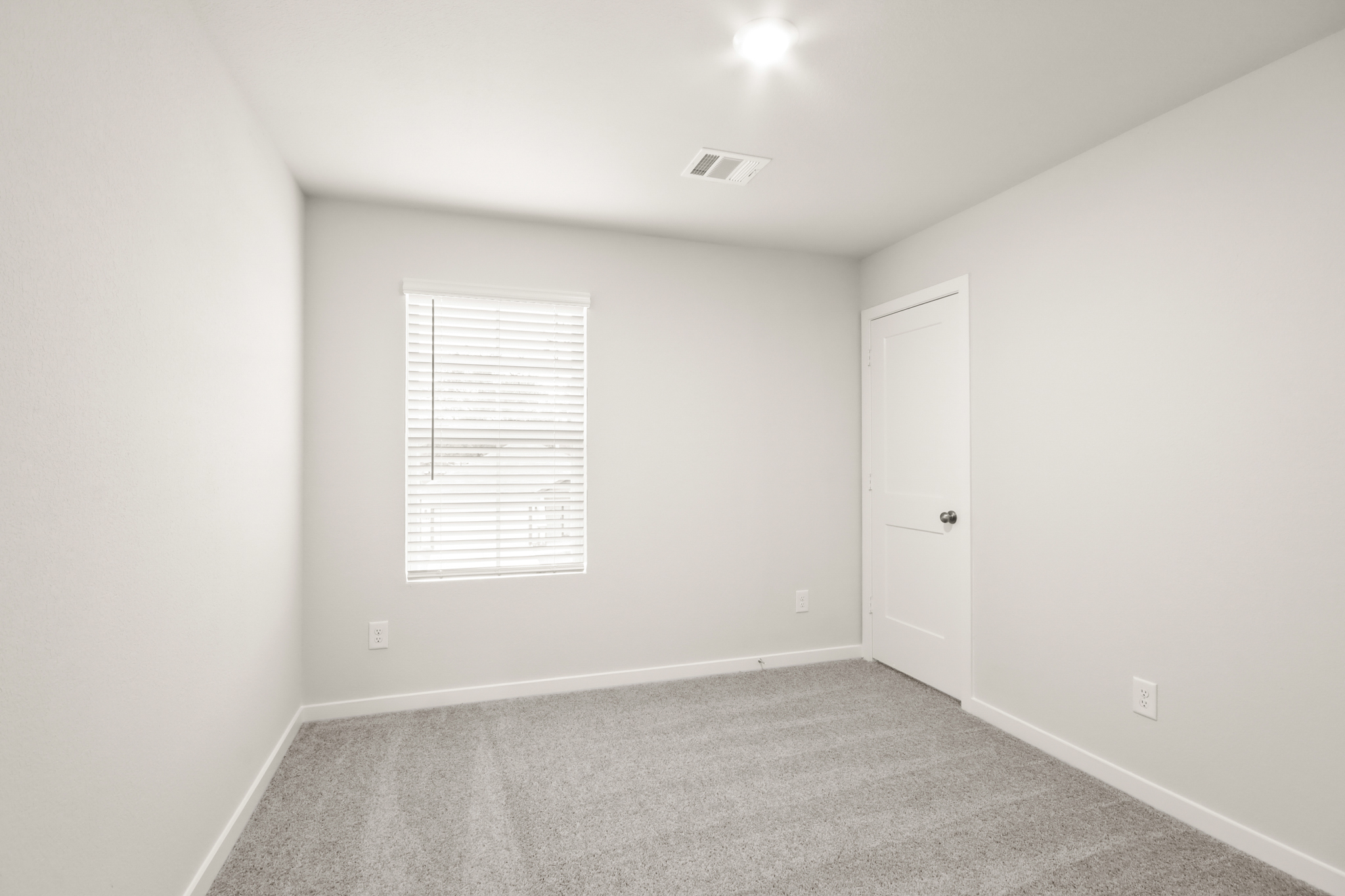 A room with a door and a window.