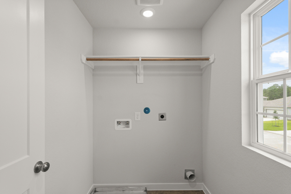 A white wall with a window.