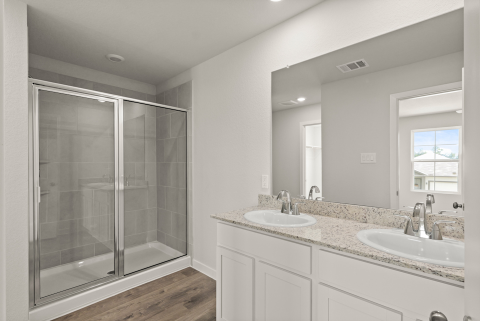 A bathroom with a glass shower.