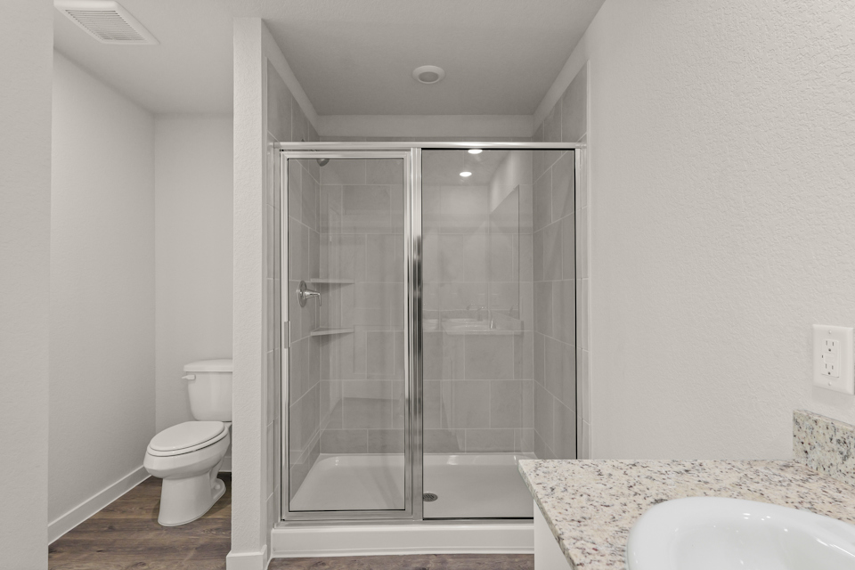 A bathroom with a glass shower.