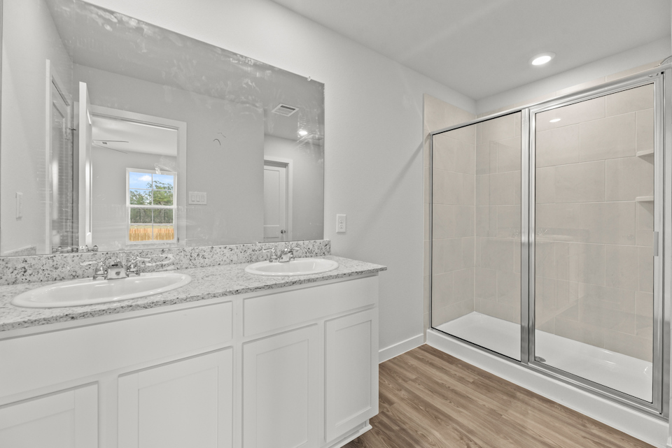 A bathroom with a glass shower.