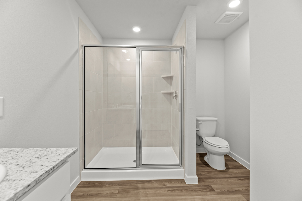 A bathroom with a glass shower.