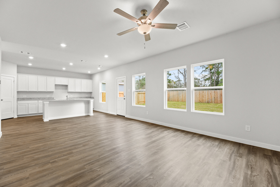 A large kitchen with white cabinets.