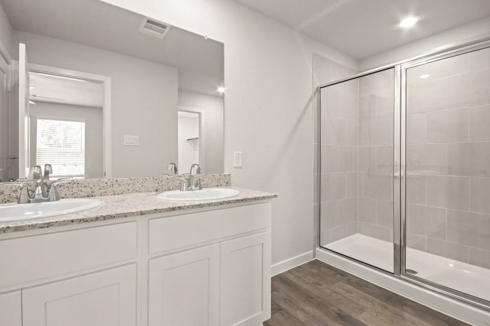 A bathroom with a glass shower.