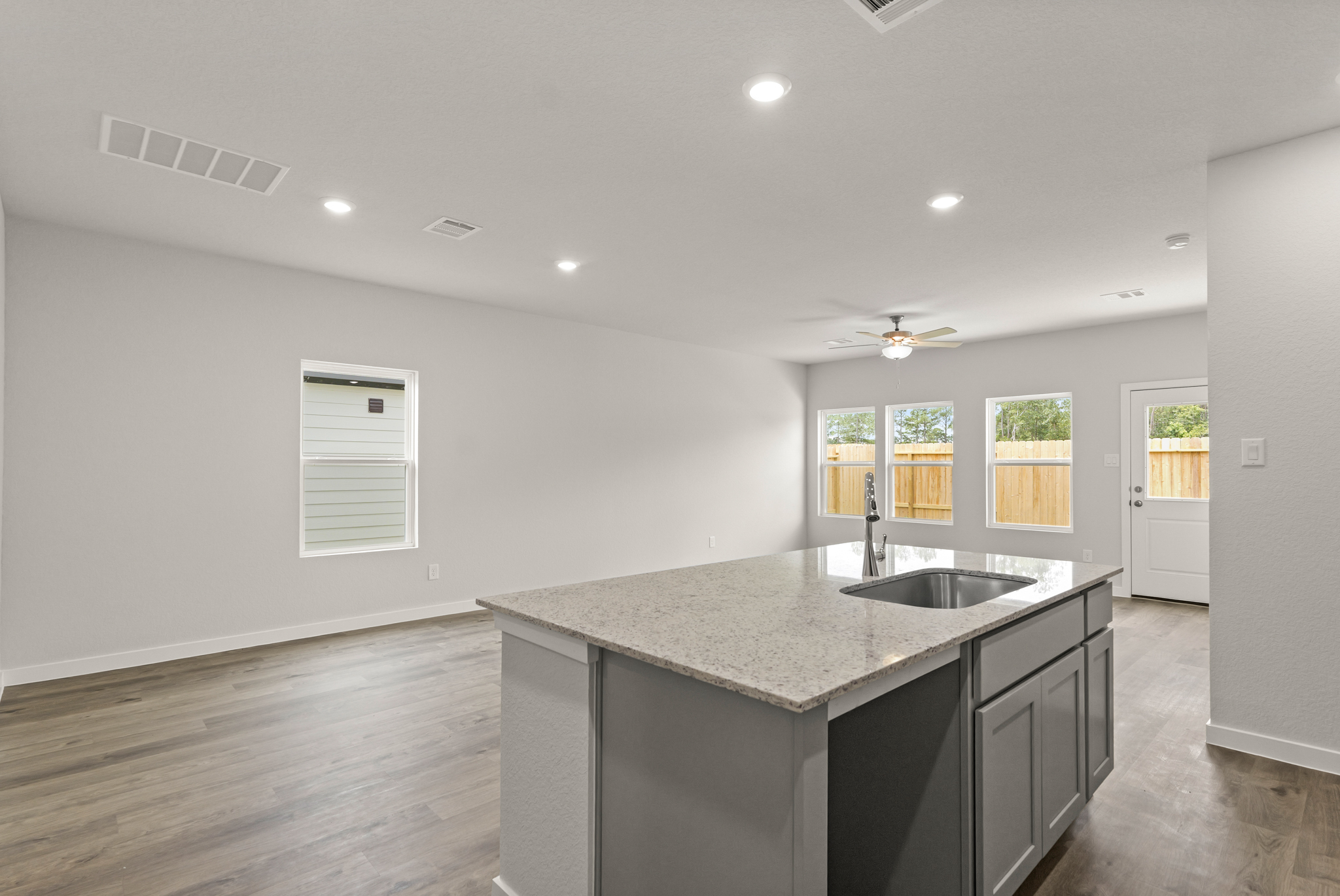A kitchen with a marble countertop.