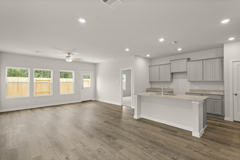 A large kitchen with white cabinets.