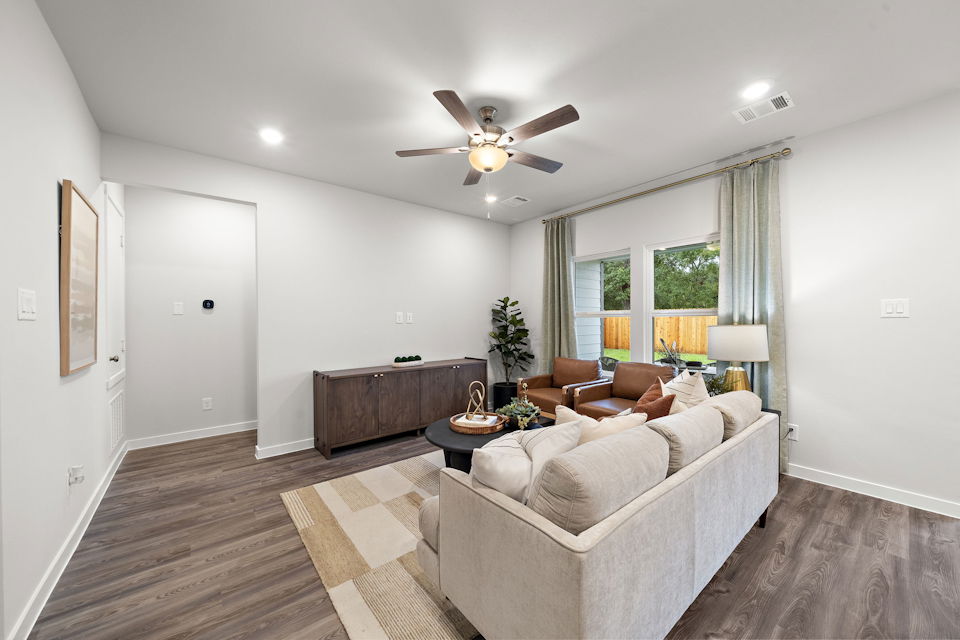 A living room with a couch and a table.