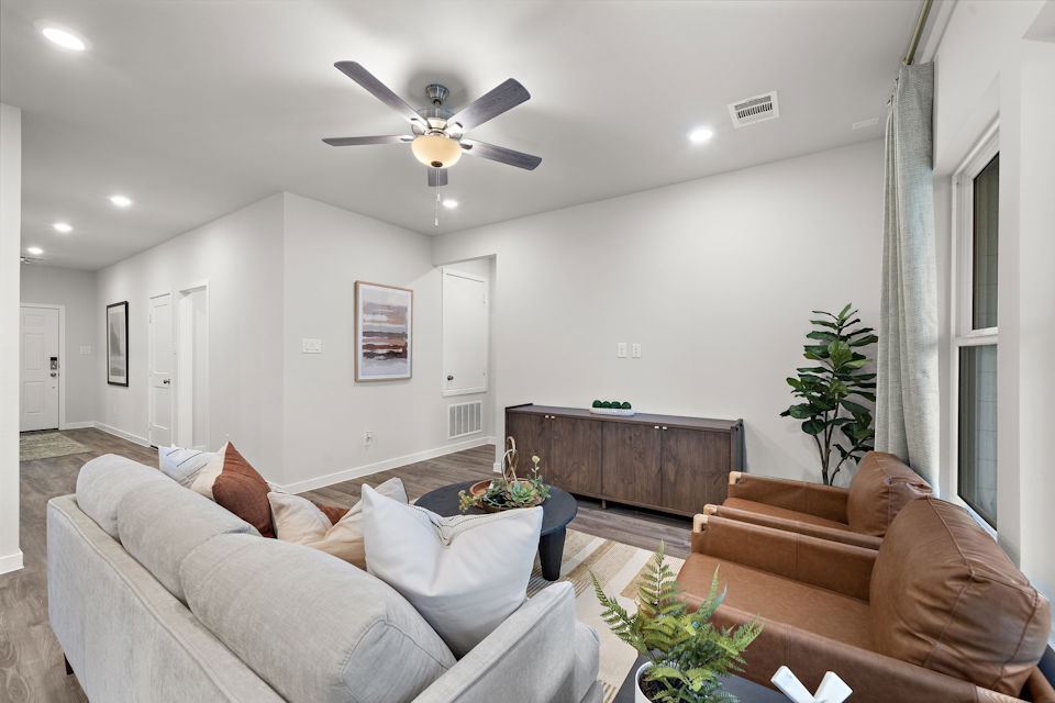 A living room with a couch and a table.