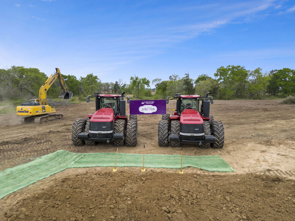 A few tractors in a field.