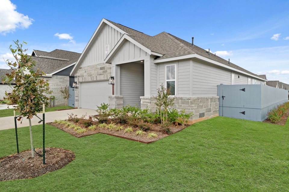 A house with a green lawn.