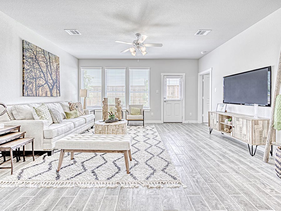 A living room with a tv and couches.