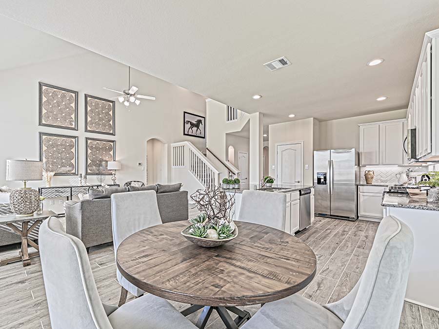 A kitchen with a dining table.