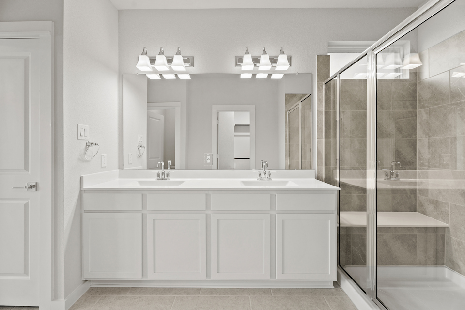 A bathroom with a glass shower.