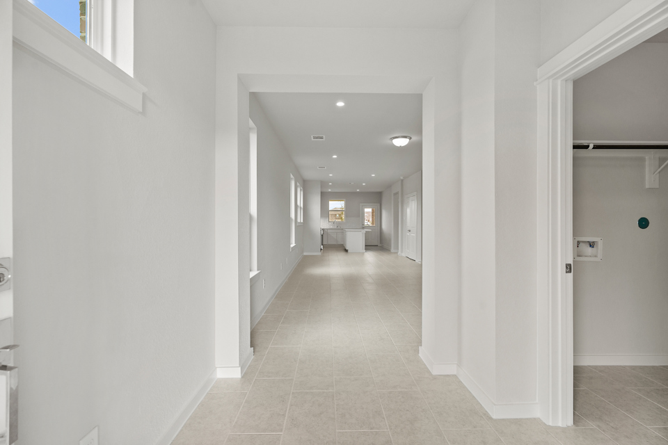 A long hallway with white walls.