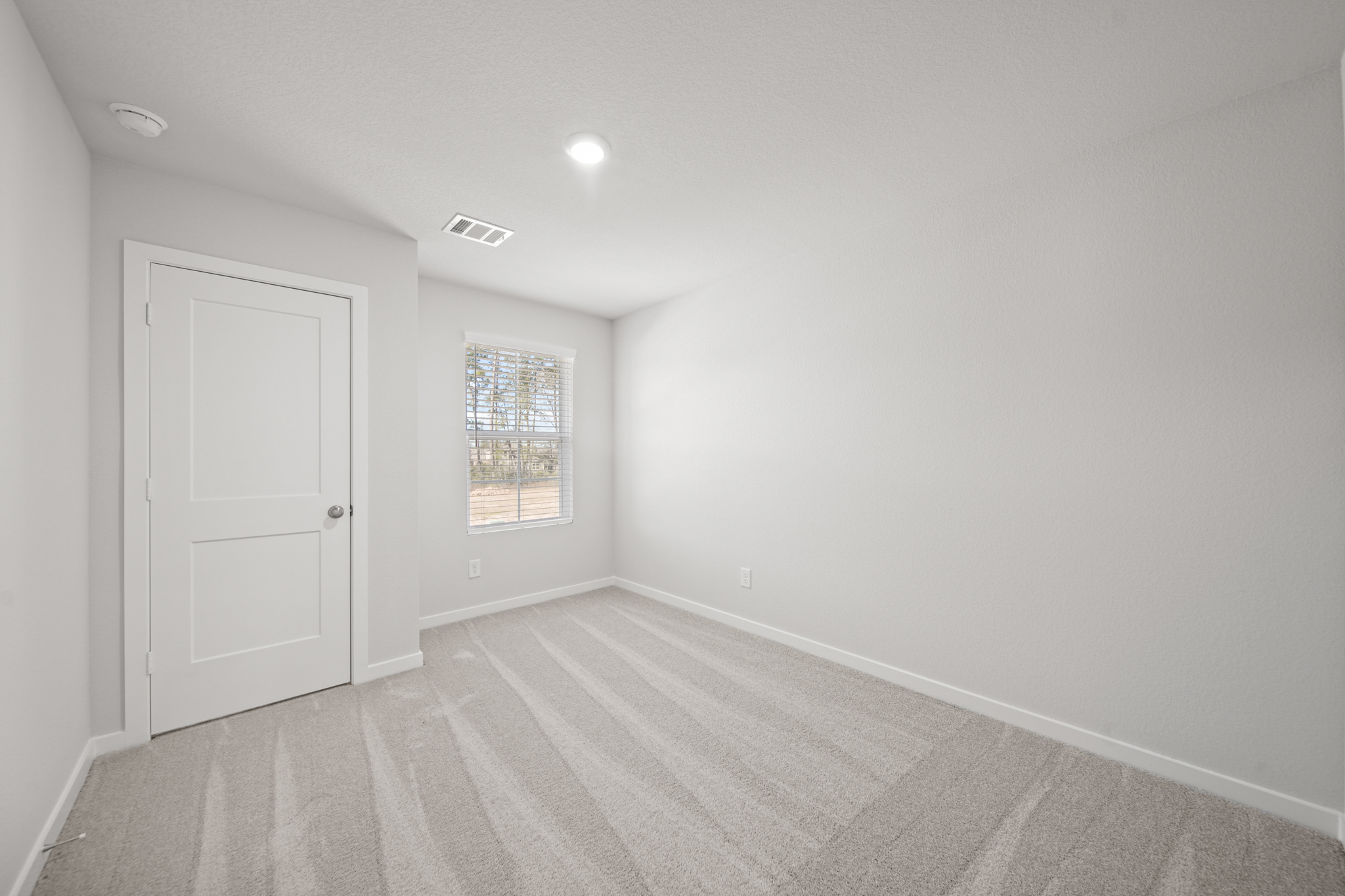 A room with a door and a window.