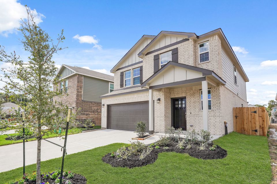 A house with a large front yard.