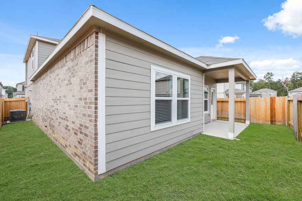 A small house with a fence.