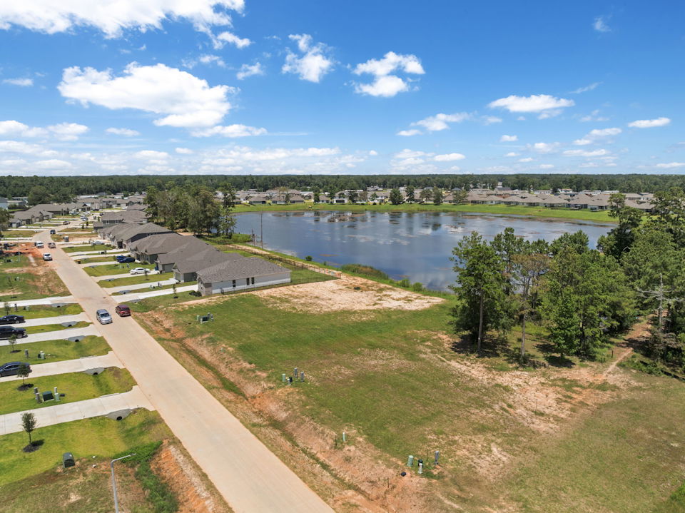 A river with a road and trees.