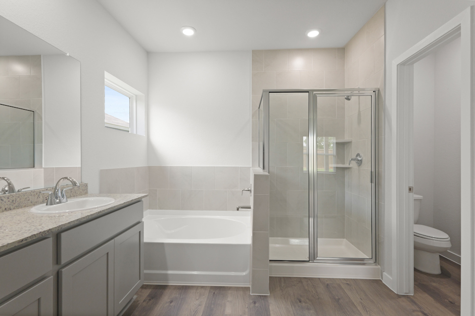 A bathroom with a glass shower.