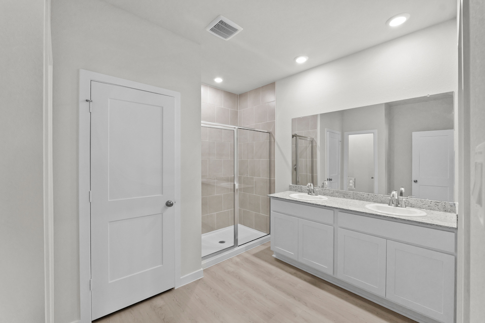 A bathroom with a glass shower.
