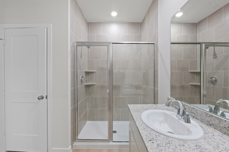 A bathroom with a glass shower.